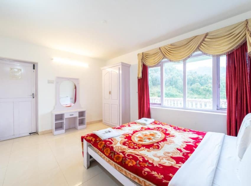 Book TWO BEDROOM DELUXE room in Ooty