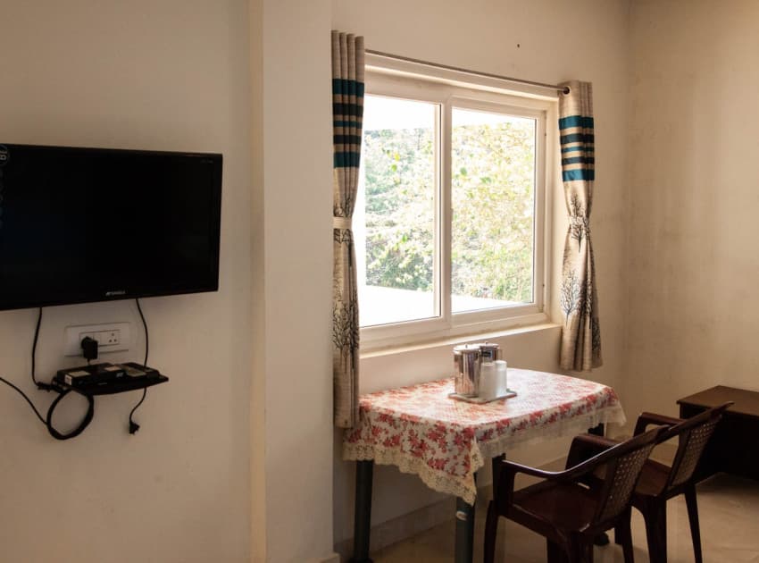 Book Double cot + one Single sofacum bed room in Valparai