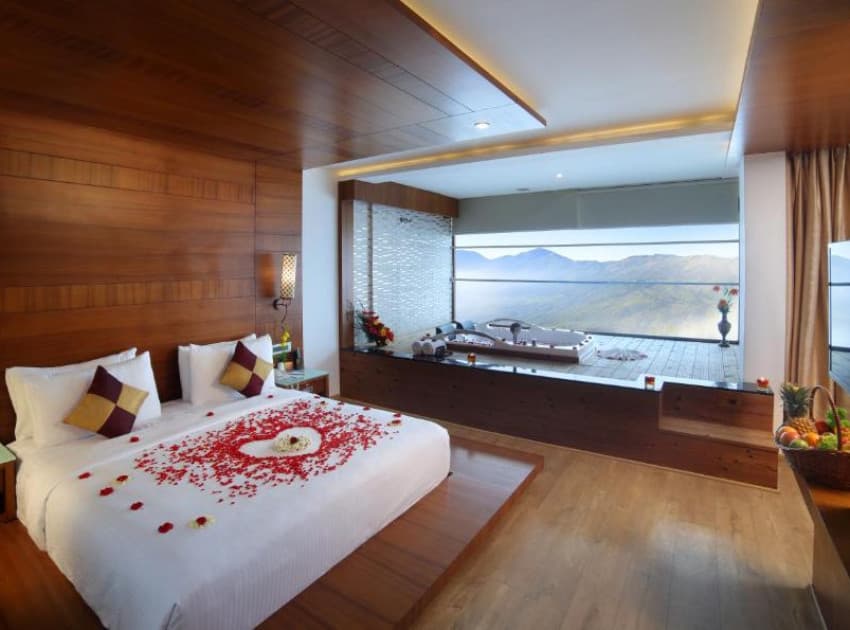 Book Madhura - Honeymoon Jacuzzi Suite room in Munnar