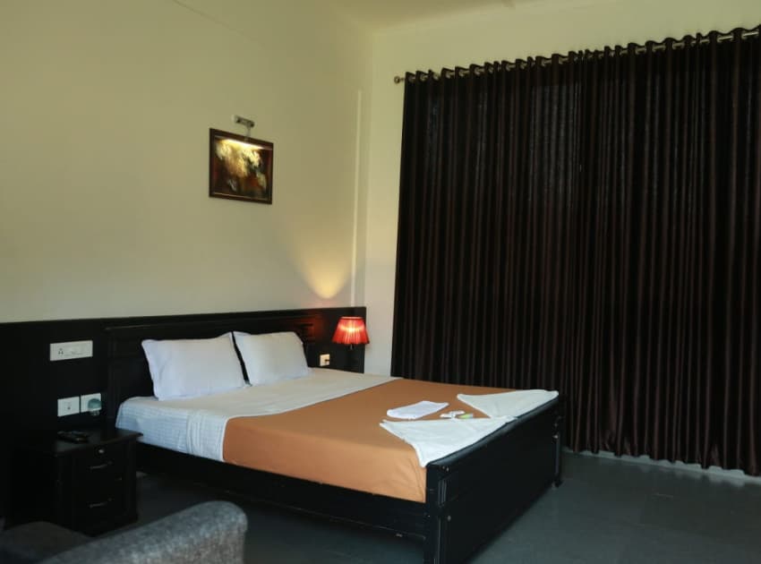 Book First Floor AC Deluxe Room room in Megamalai